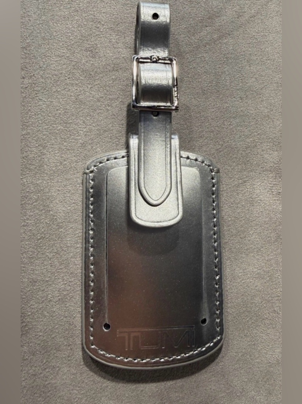 NEW Tumi 3.625” x 2.25” Leather Luggage Name Tag w/ Buckle - METALLIC SILVER